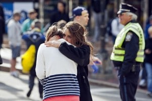 Woman comforts another after explosions interrupted the 117th Boston Marathon